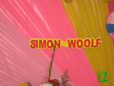 66) Simons name in lights